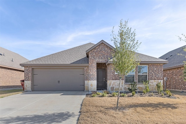 view of front of property with a garage