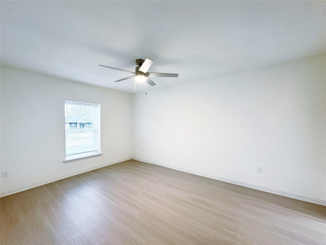 empty room featuring ceiling fan and light wood-type flooring