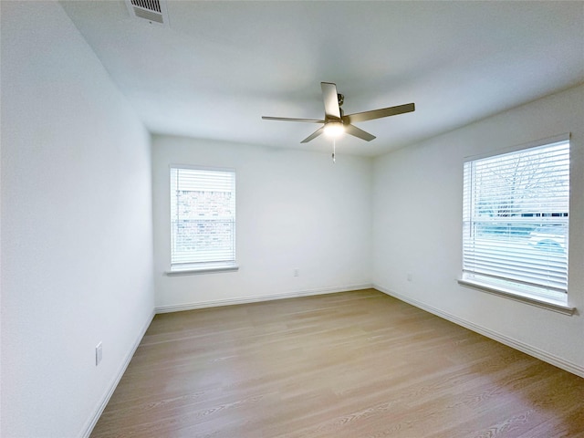 spare room with ceiling fan and light hardwood / wood-style floors