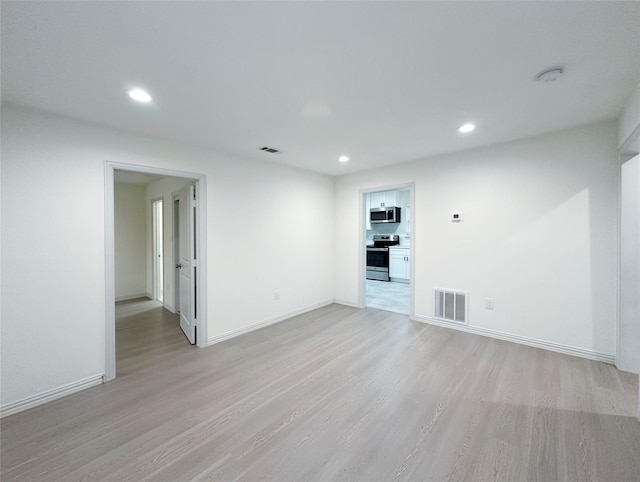 empty room with light wood-type flooring