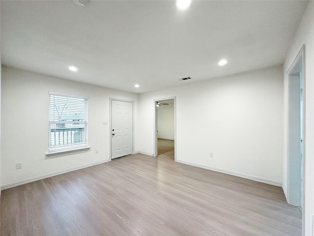 unfurnished room with light hardwood / wood-style flooring