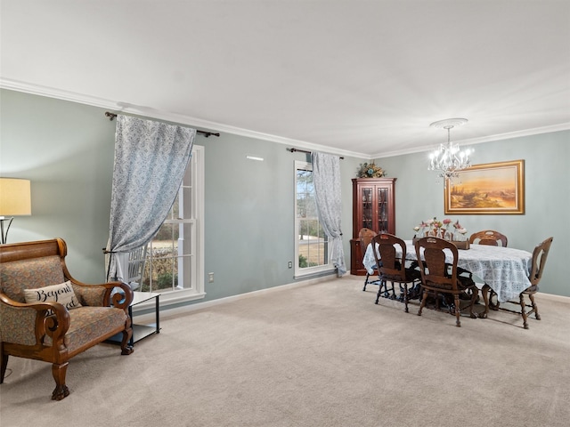 dining room with crown molding, light colored carpet, and a notable chandelier