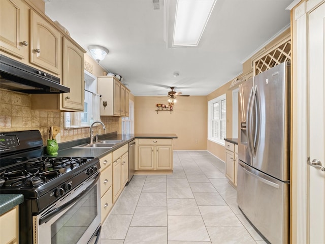 kitchen featuring light tile patterned flooring, sink, decorative backsplash, kitchen peninsula, and stainless steel appliances