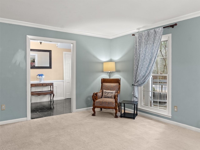 sitting room with carpet floors and ornamental molding