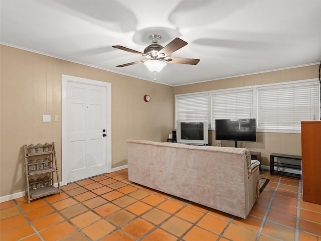 tiled living room with ornamental molding and ceiling fan