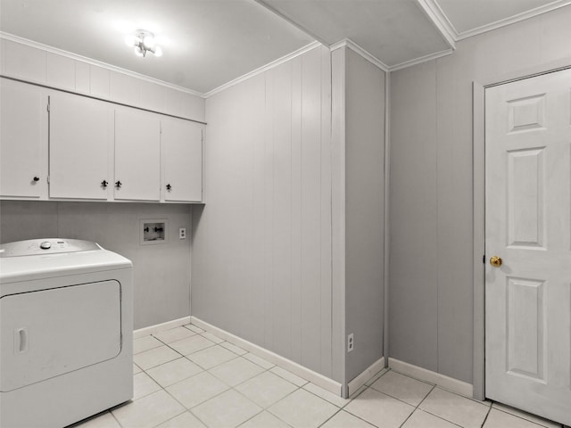 washroom featuring washer / clothes dryer, light tile patterned floors, ornamental molding, and cabinets