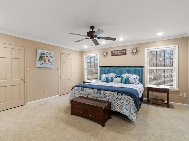 carpeted bedroom with crown molding, ceiling fan, and multiple windows