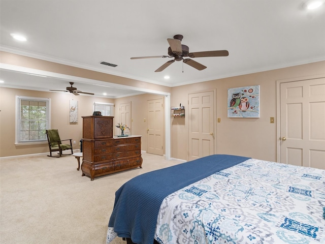 carpeted bedroom featuring ornamental molding and ceiling fan