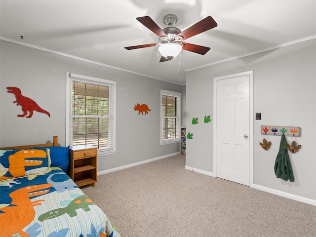 bedroom featuring crown molding, ceiling fan, and carpet flooring