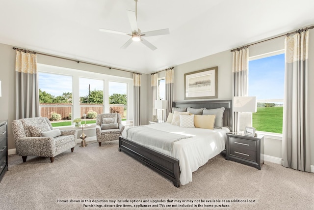 bedroom featuring light colored carpet and ceiling fan