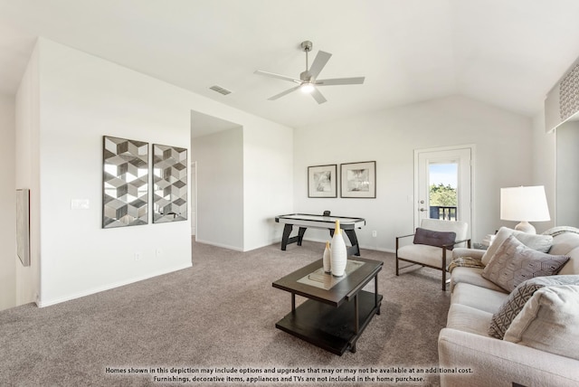 carpeted living room with ceiling fan and lofted ceiling