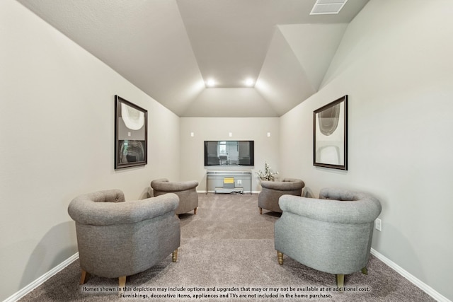 living room with vaulted ceiling and carpet flooring