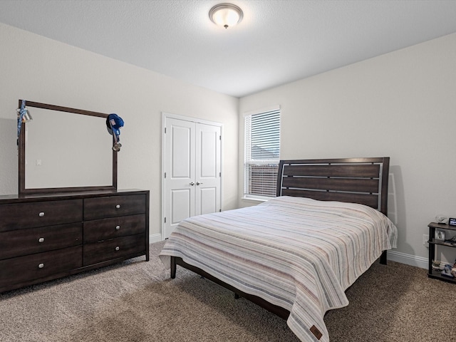 bedroom featuring a closet and carpet