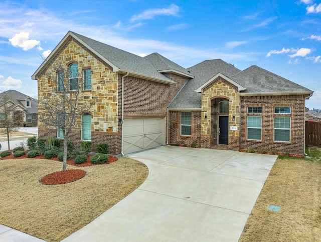 view of front of property featuring a garage and a front yard