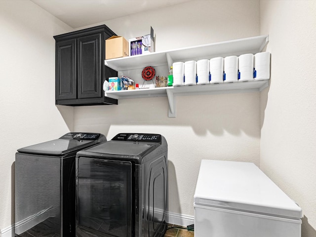 laundry area with cabinets and washer and dryer