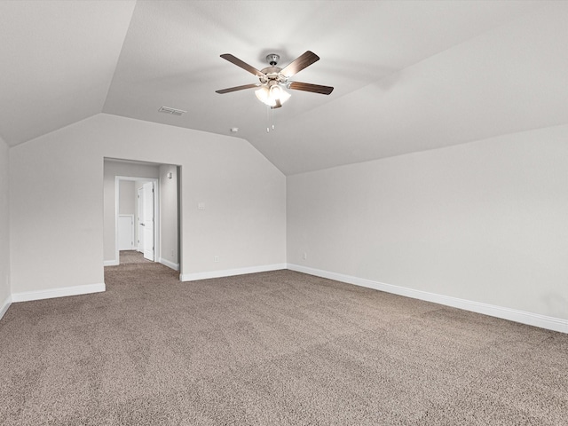 additional living space with ceiling fan, lofted ceiling, and carpet flooring