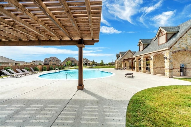 view of swimming pool with a pergola and a patio