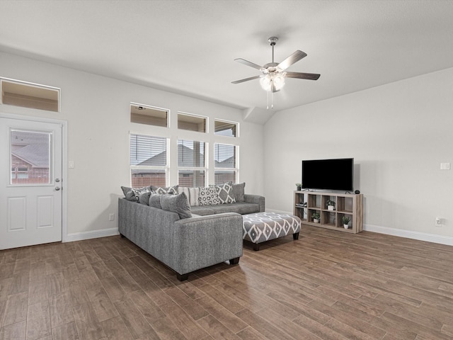 living room with vaulted ceiling, dark wood-type flooring, and ceiling fan