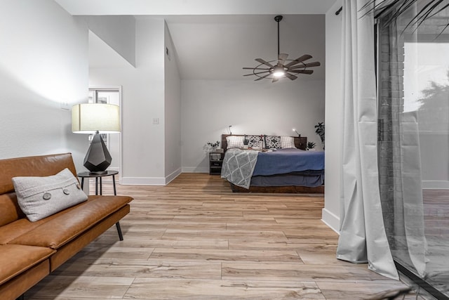 bedroom with baseboards and light wood finished floors