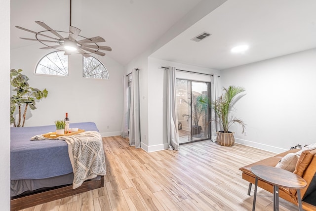 bedroom with access to exterior, wood finished floors, visible vents, and baseboards