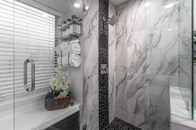 full bath featuring a tile shower