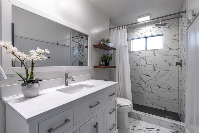 bathroom with vanity, toilet, a stall shower, and marble finish floor