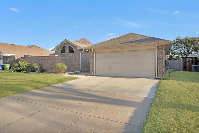 view of front of home featuring concrete driveway, a front yard, and fence