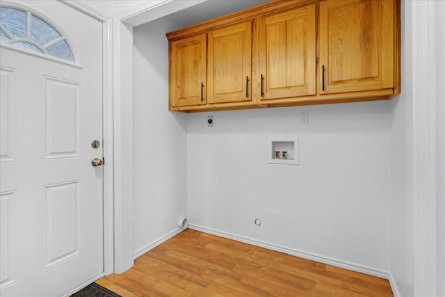 laundry area with baseboards, light wood-style floors, cabinet space, electric dryer hookup, and washer hookup
