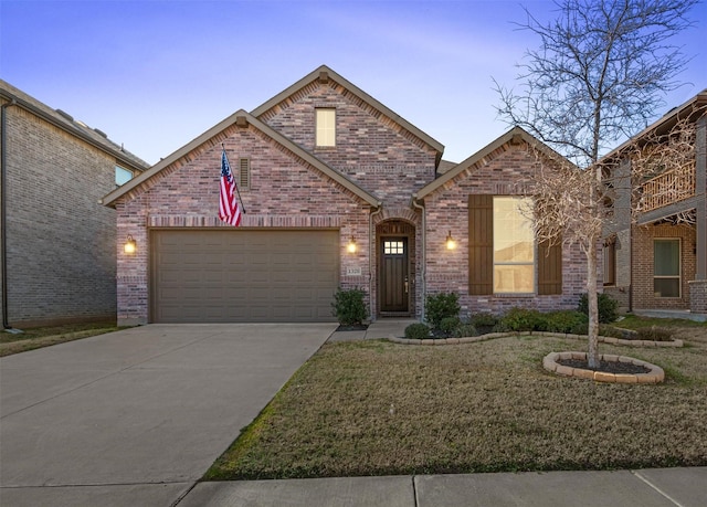 view of front facade featuring a garage and a lawn