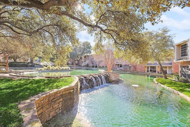 3550 Country Square Dr Unit 505, Carrollton, TX 75006 - view of swimming pool with a pool with connected hot tub