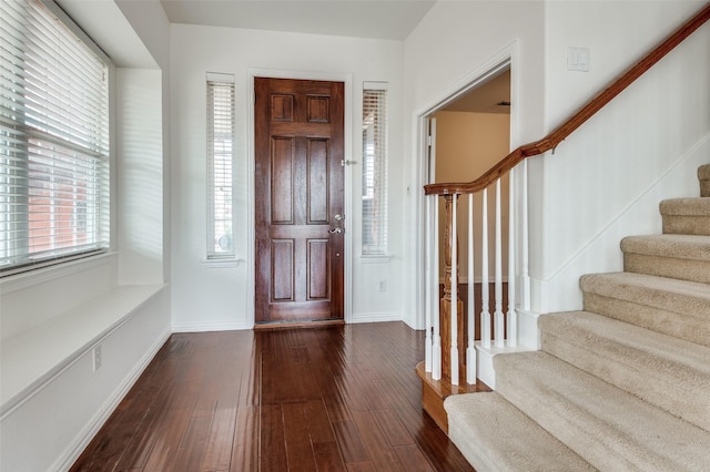 entryway with dark wood-type flooring