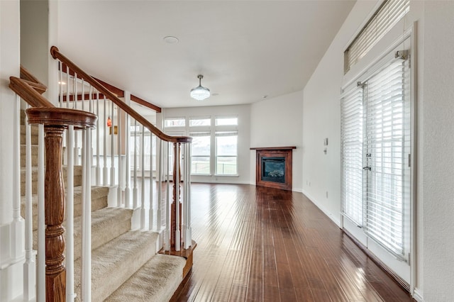 unfurnished living room with wood-type flooring