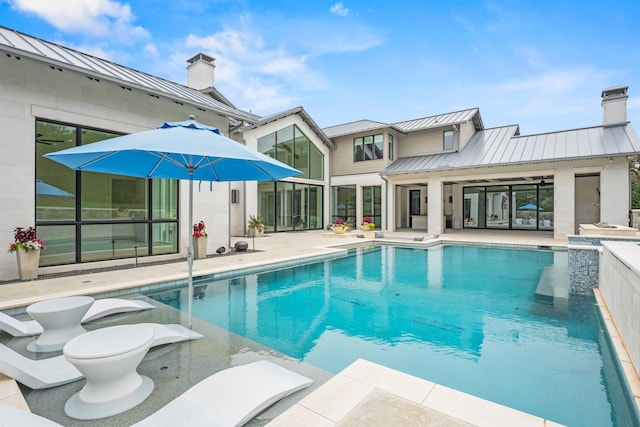 outdoor pool featuring a patio