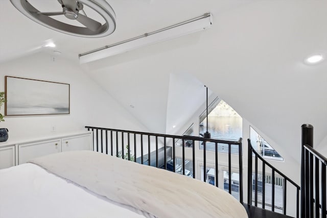 bedroom with high vaulted ceiling