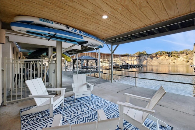 view of patio featuring a water view