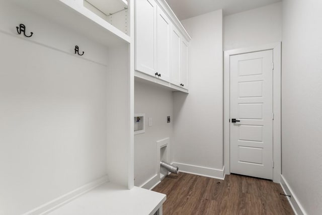 laundry area featuring dark hardwood / wood-style floors, cabinets, hookup for an electric dryer, and hookup for a washing machine