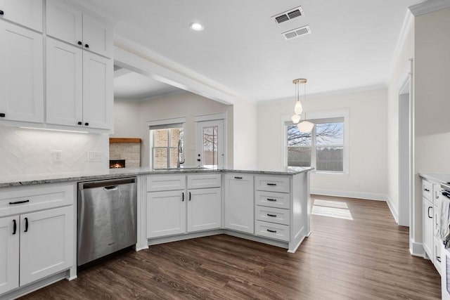 kitchen featuring decorative light fixtures, sink, white cabinets, stainless steel dishwasher, and crown molding