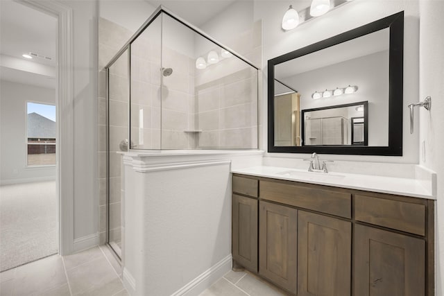 bathroom with a shower stall, tile patterned flooring, visible vents, and vanity