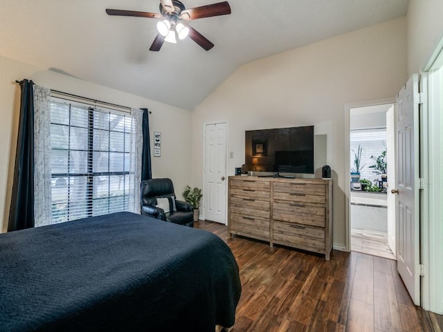 bedroom featuring ceiling fan, lofted ceiling, and dark hardwood / wood-style flooring