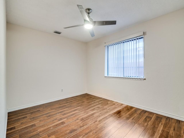 unfurnished room featuring hardwood / wood-style floors and ceiling fan