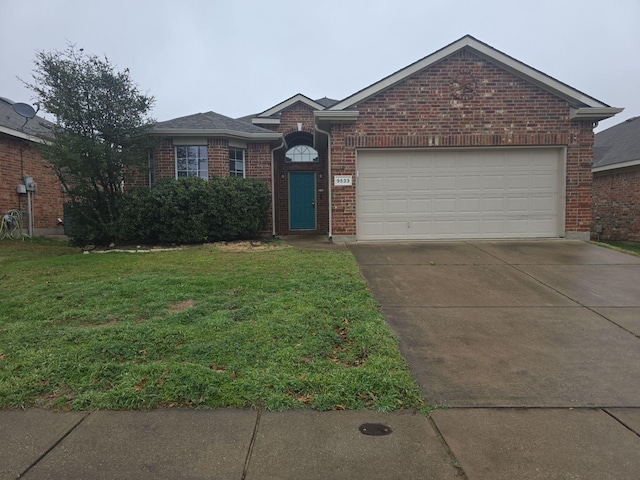 single story home featuring a garage and a front yard