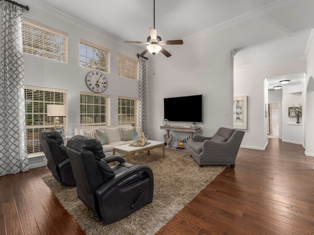 living room with crown molding and dark hardwood / wood-style flooring