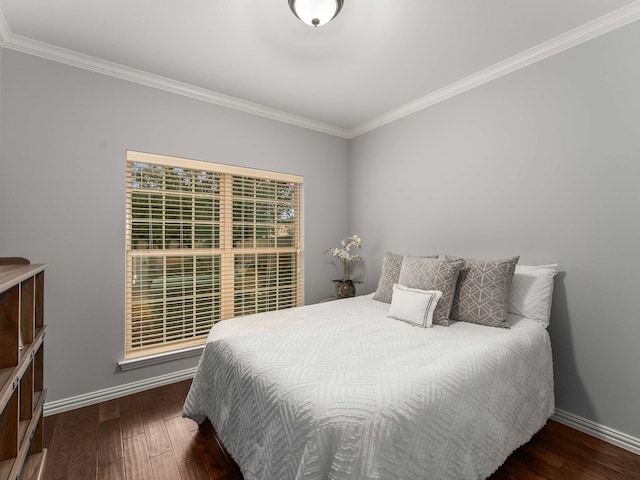 bedroom featuring dark hardwood / wood-style flooring and crown molding