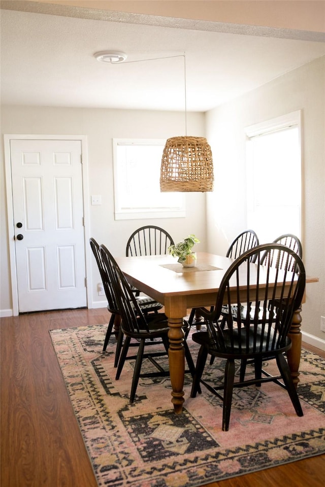 dining area featuring dark hardwood / wood-style flooring