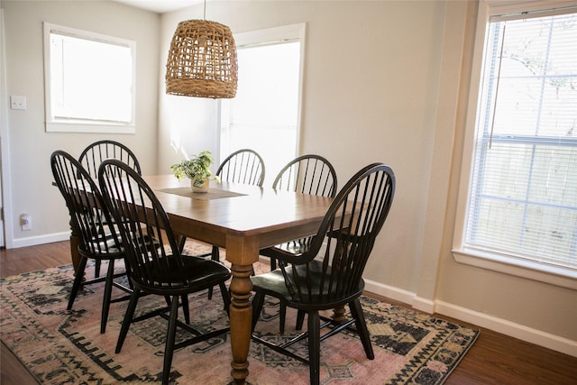 dining area with dark hardwood / wood-style floors and a wealth of natural light