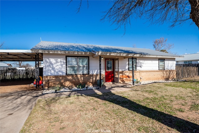 single story home featuring a carport and a front lawn