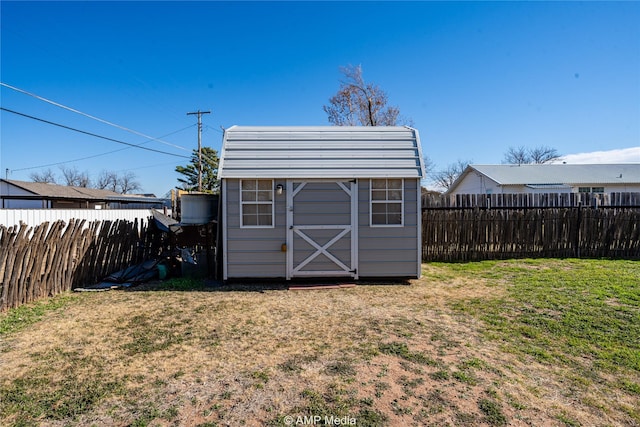 view of outbuilding featuring a lawn