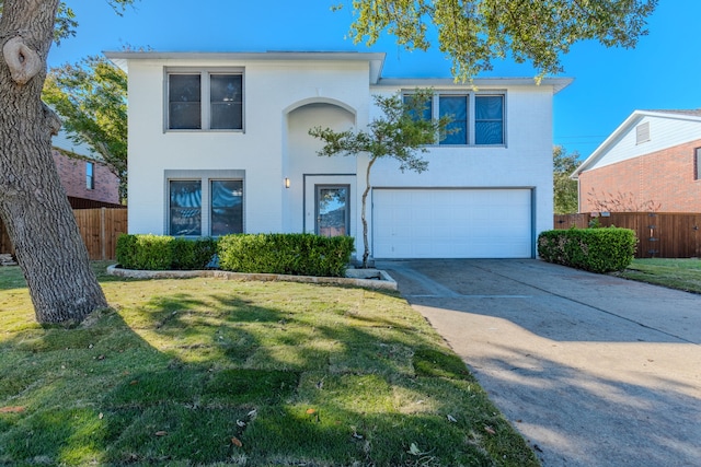 view of front facade featuring a garage and a front lawn