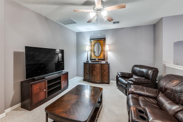 living room with ceiling fan and light colored carpet