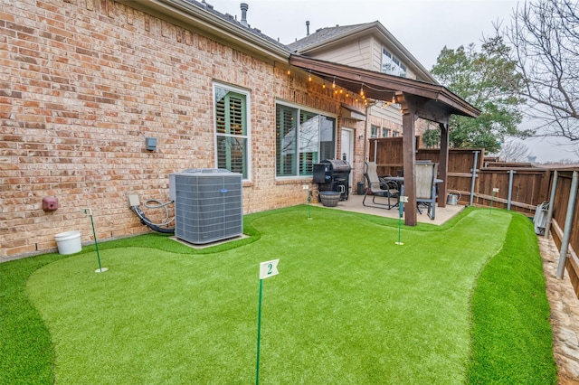 back of property featuring cooling unit and a patio